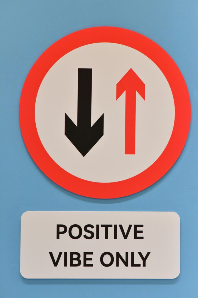 Circular sign with arrows and 'positive vibe only' message on blue background. Positive Thinking 
Meditation Kaise Kare