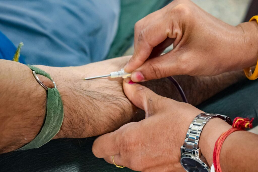 Detailed view of a medical professional administering an injection for healthcare purposes.