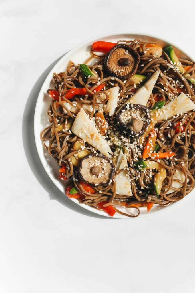 Mouth-watering soba noodles with vegetables and sesame seeds, perfect for a Japanese cuisine article.
Muscle Gain Kaise Kare